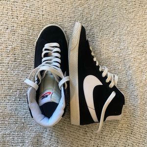Black high top Nikes (kind of like blazers)